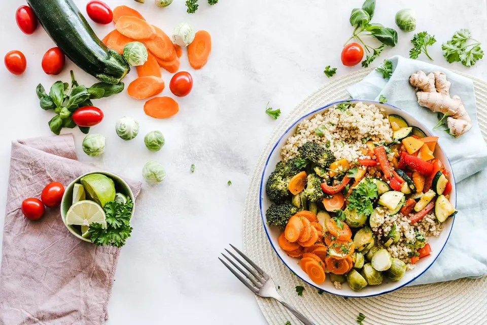 Overhead photo of pasta with basil and vegetables